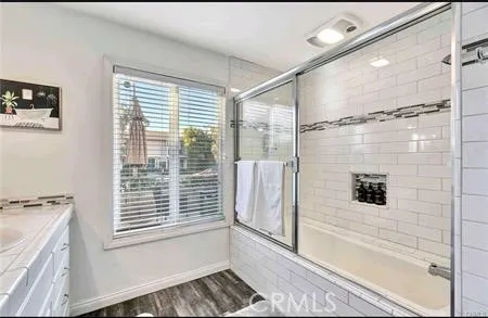 a bathroom with a tub and a shower