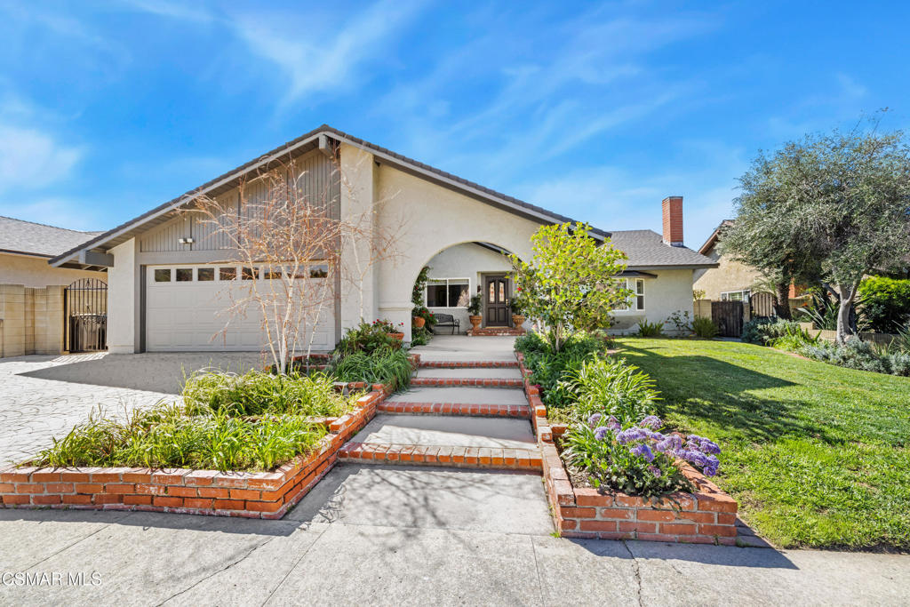 5914 Cochran Street Simi Valley, CA 93063 - Photo 1 of 23 a front view of a house with a yard