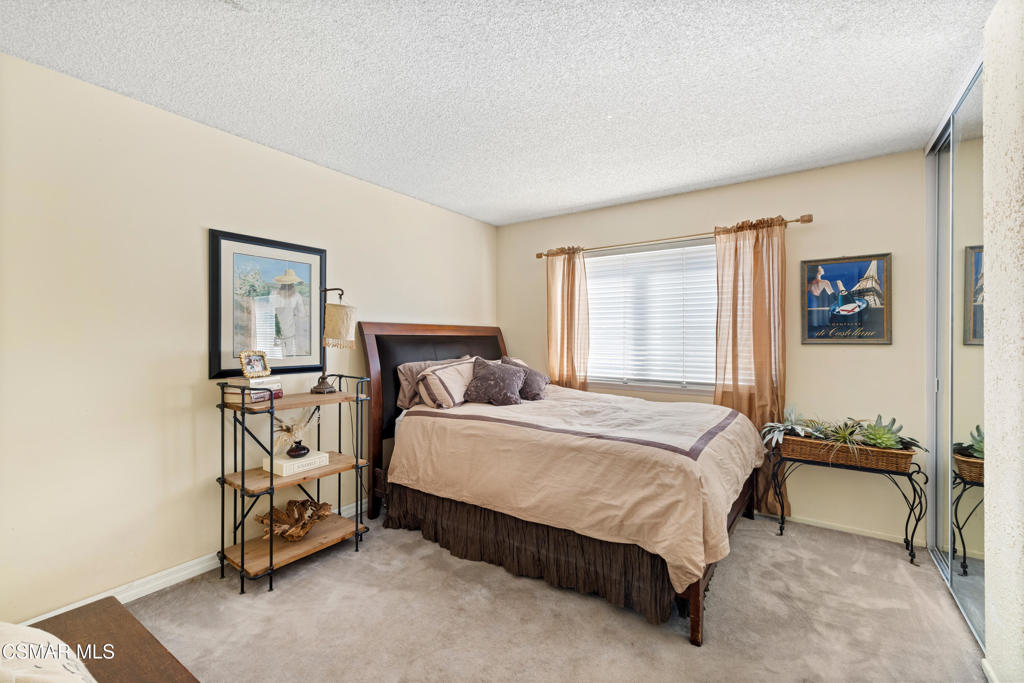 5914 Cochran Street Simi Valley, CA 93063 - Photo 16 of 23 a bedroom with a bed and a table