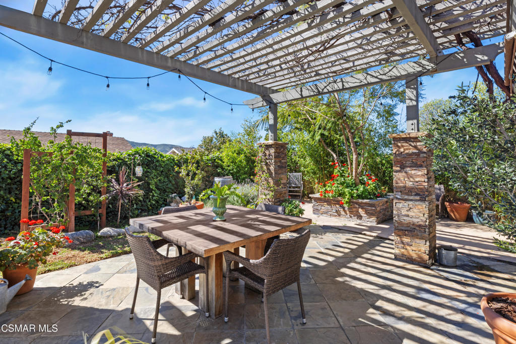 5914 Cochran Street Simi Valley, CA 93063 - Photo 20 of 23 a view of an outdoor space with a table and chairs