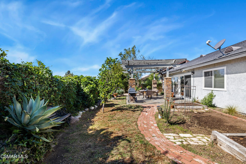 5914 Cochran Street Simi Valley, CA 93063 - Photo 22 of 23 a view of a house with backyard sitting area and garden