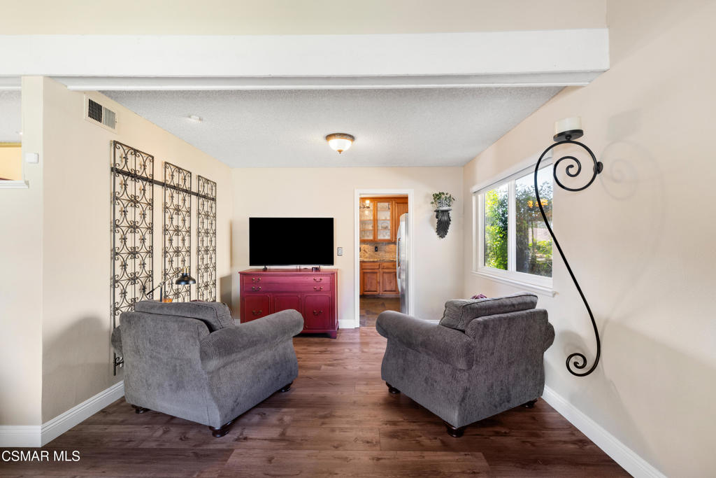 5914 Cochran Street Simi Valley, CA 93063 - Photo 7 of 23 a living room with furniture and a flat screen tv