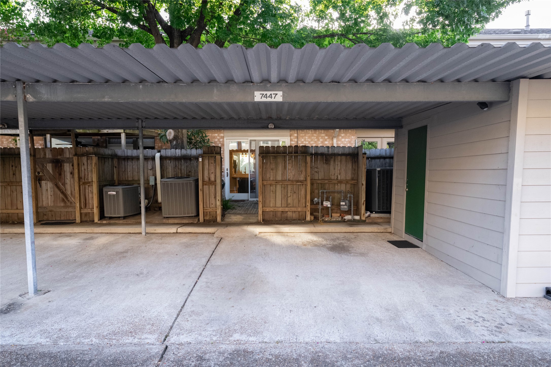 7447 Brompton Street, Unit 7447 Houston, TX 77025 - Photo 27 of 27 There are two covered parking space next to the outdoor patio gate.