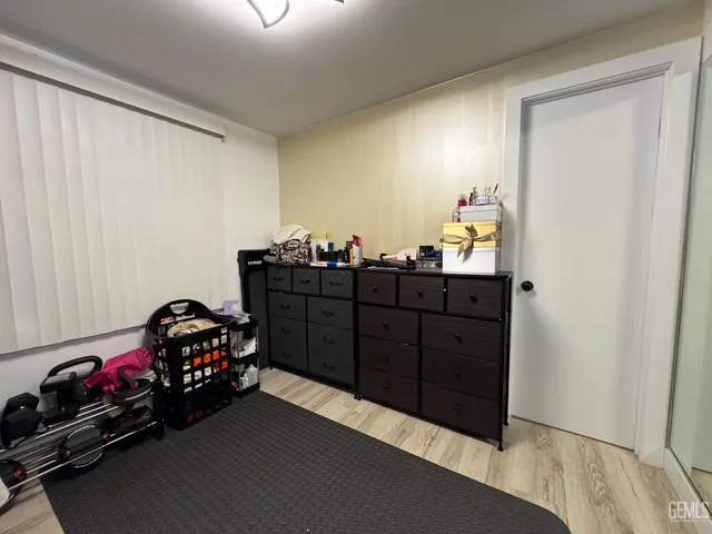 a room with a dresser and a mirror