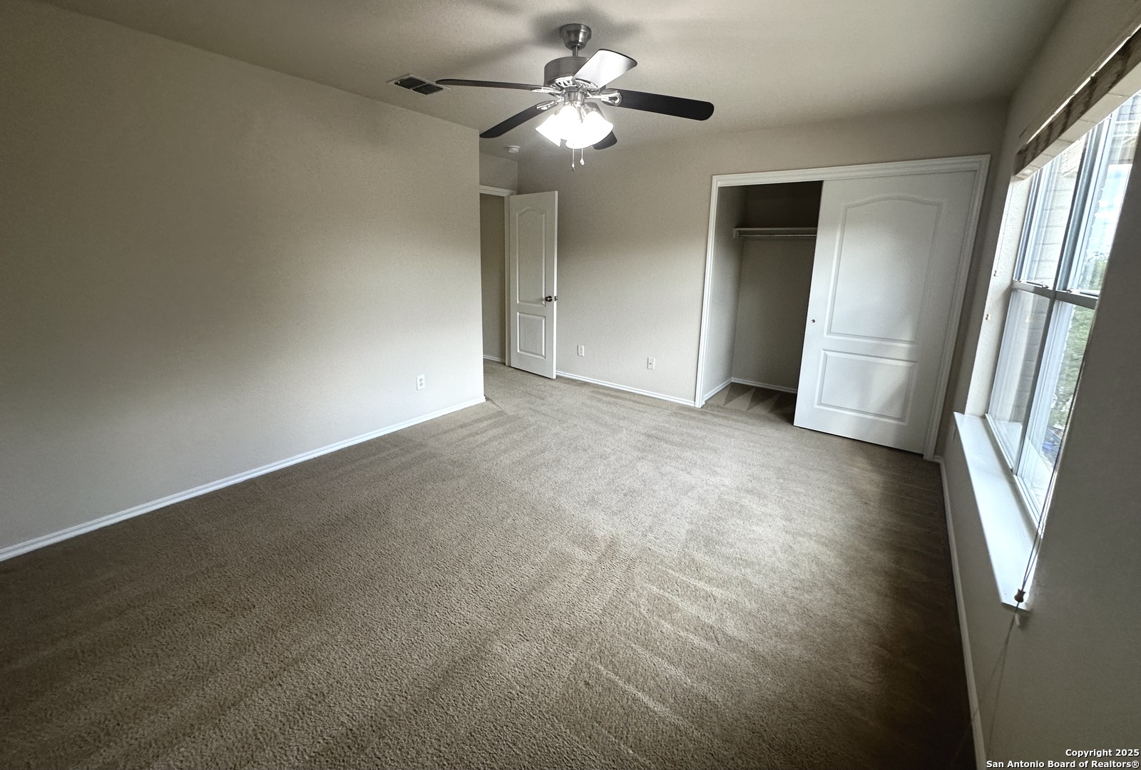 6741 Wayman Ridge Live Oak, TX 78233 - Photo 16 of 25 a view of a livingroom with a ceiling fan and window