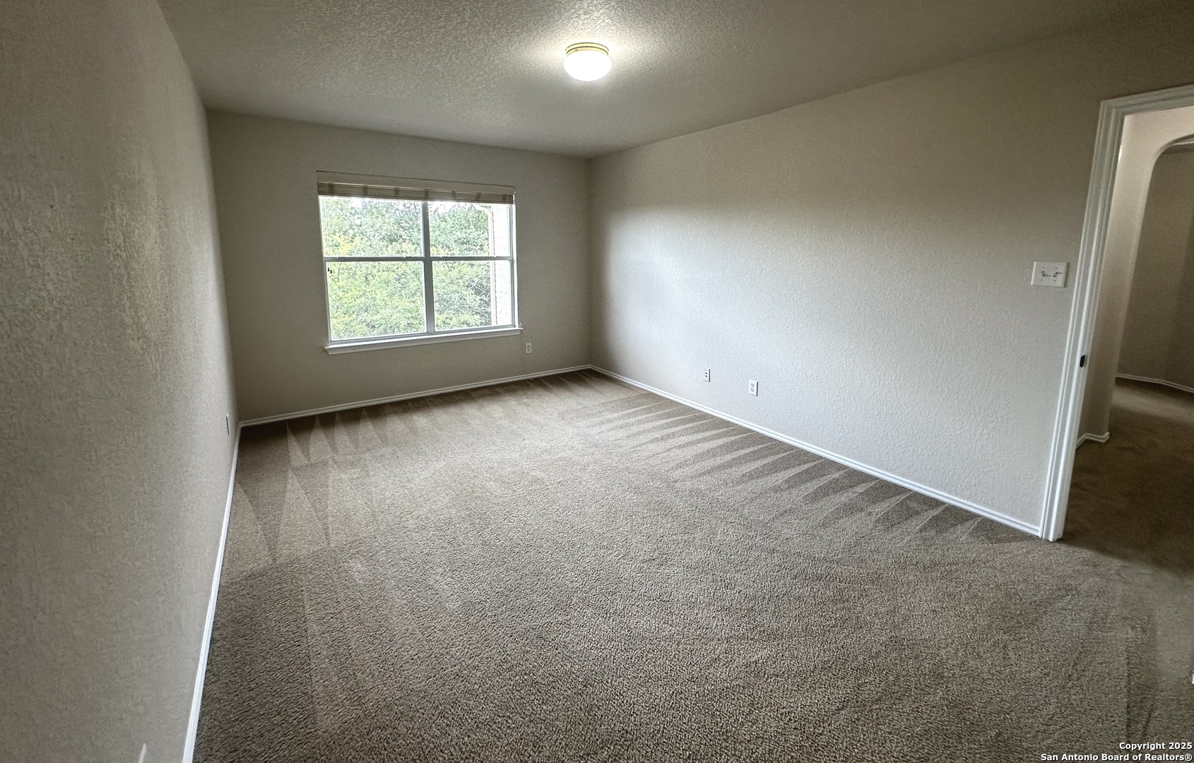 6741 Wayman Ridge Live Oak, TX 78233 - Photo 19 of 25 an empty room with windows