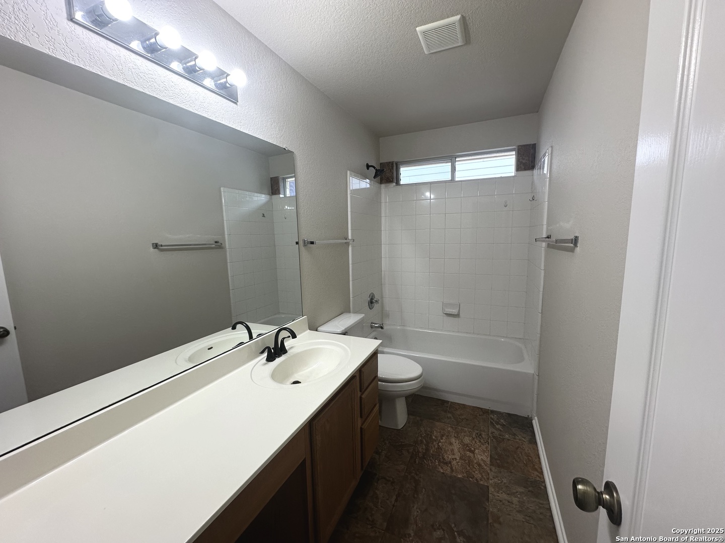 6741 Wayman Ridge Live Oak, TX 78233 - Photo 21 of 25 a bathroom with a sink a toilet and shower