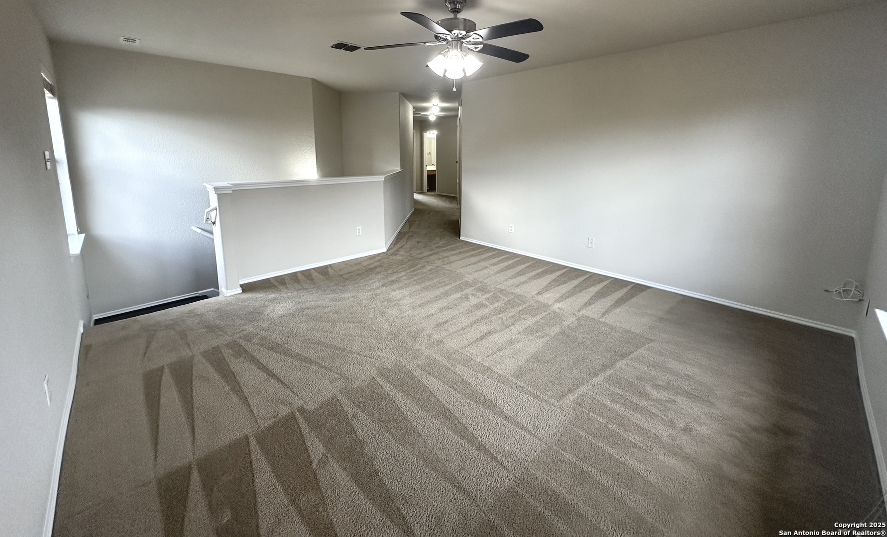 6741 Wayman Ridge Live Oak, TX 78233 - Photo 8 of 25 a view of a livingroom with a ceiling fan and window