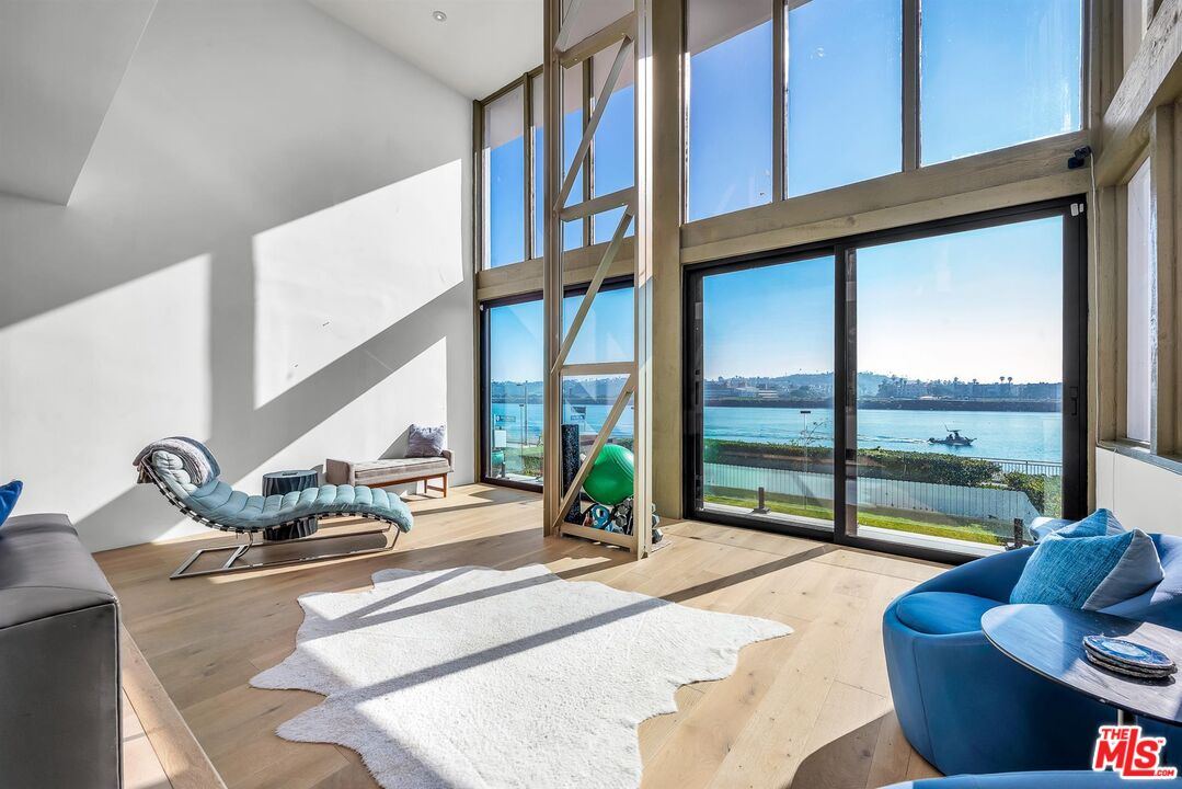 5515 Pacific Avenue, Unit 1 Marina del Rey, CA 90292 - Photo 12 of 45 a living room with furniture and floor to ceiling windows