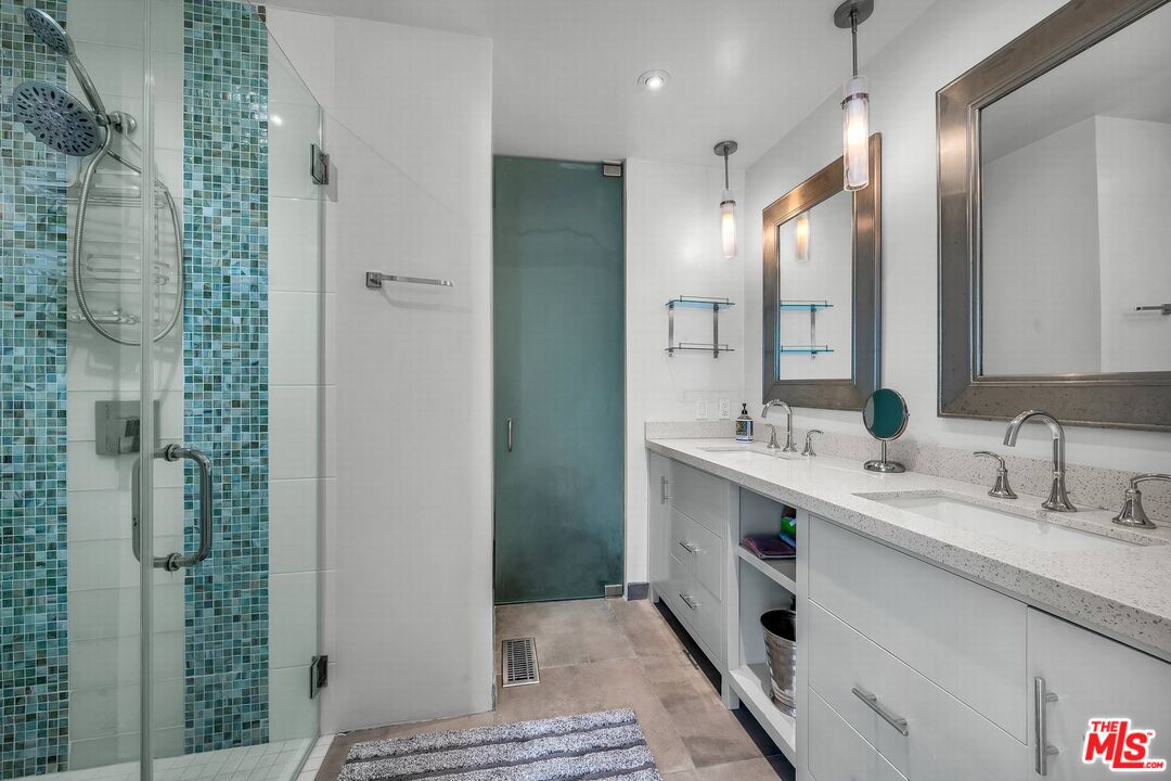 5515 Pacific Avenue, Unit 1 Marina del Rey, CA 90292 - Photo 26 of 45 a bathroom with a double vanity sink mirror and shower