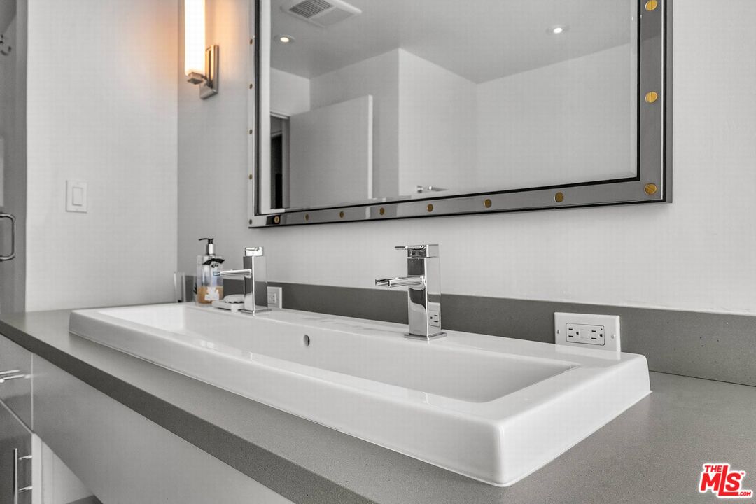 5515 Pacific Avenue, Unit 1 Marina del Rey, CA 90292 - Photo 35 of 45 a bathroom with a sink and a mirror