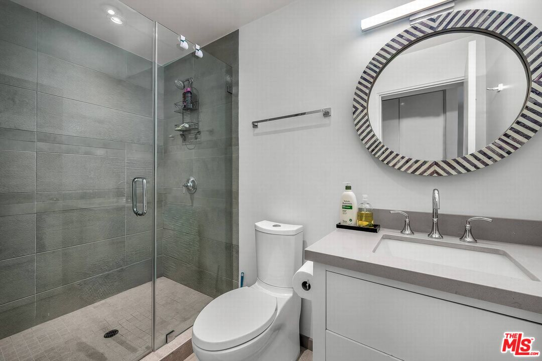 5515 Pacific Avenue, Unit 1 Marina del Rey, CA 90292 - Photo 39 of 45 a bathroom with a sink a toilet and a mirror