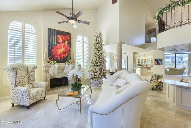 a view of a patio with table and chairs potted plants and large tree