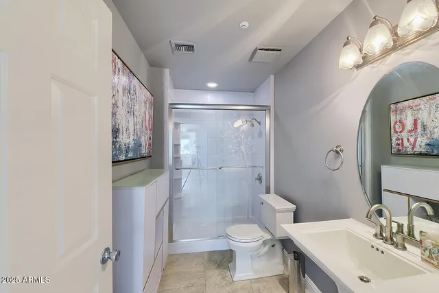 a view of a house with a porch and sitting area