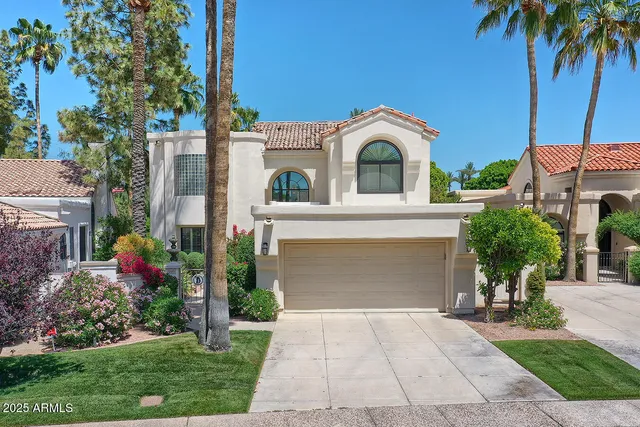 a view of a chairs and table in the patio