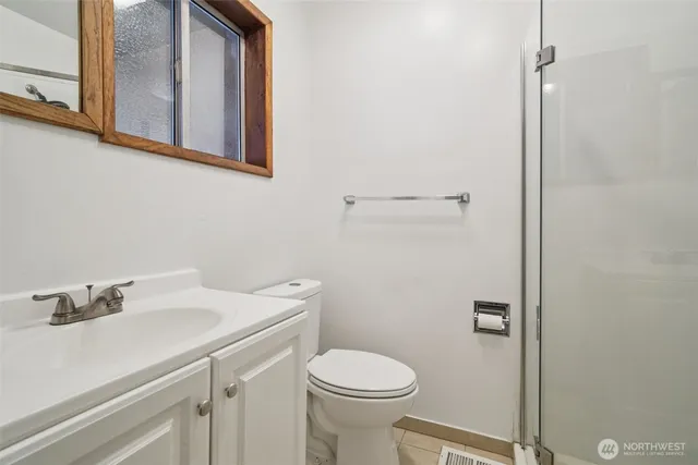 a bathroom with a sink toilet and vanity