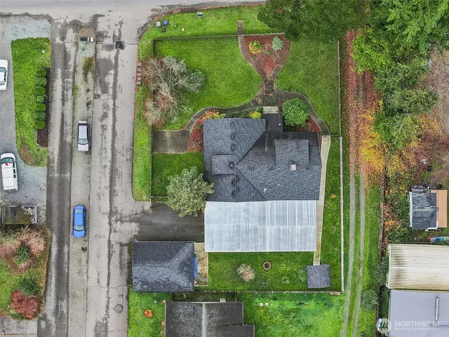 an aerial view of a house having yard
