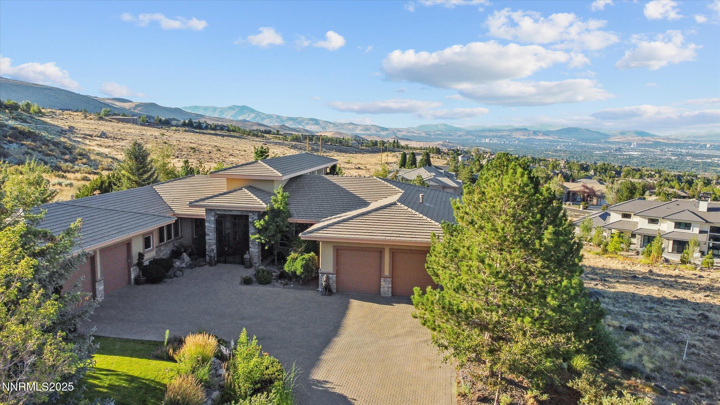 10411 Copper Cloud Drive Reno, NV 89511 - Photo 2 of 54 a view of a house with a yard and sitting area