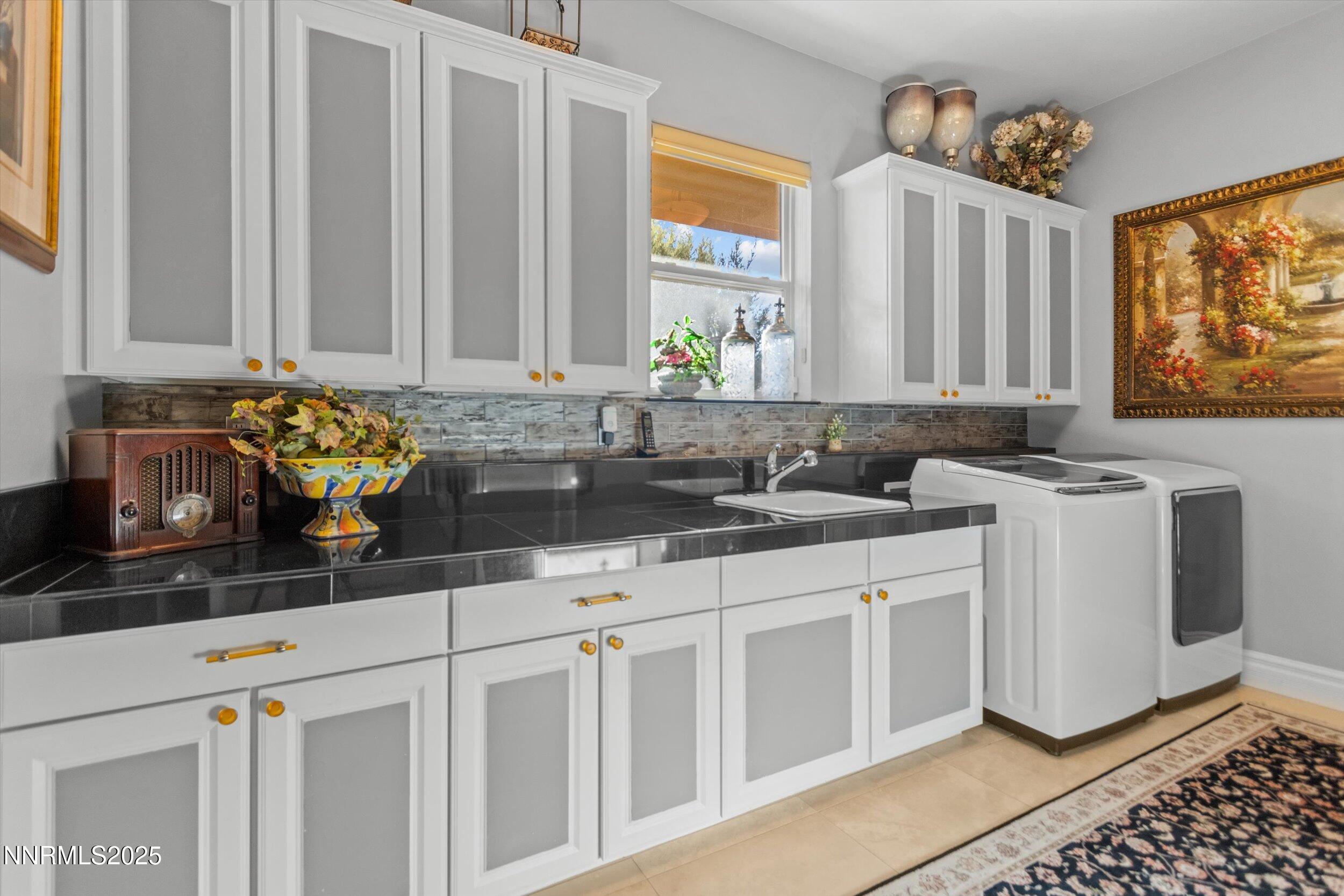 10411 Copper Cloud Drive Reno, NV 89511 - Photo 23 of 54 a kitchen with stainless steel appliances sink and cabinets