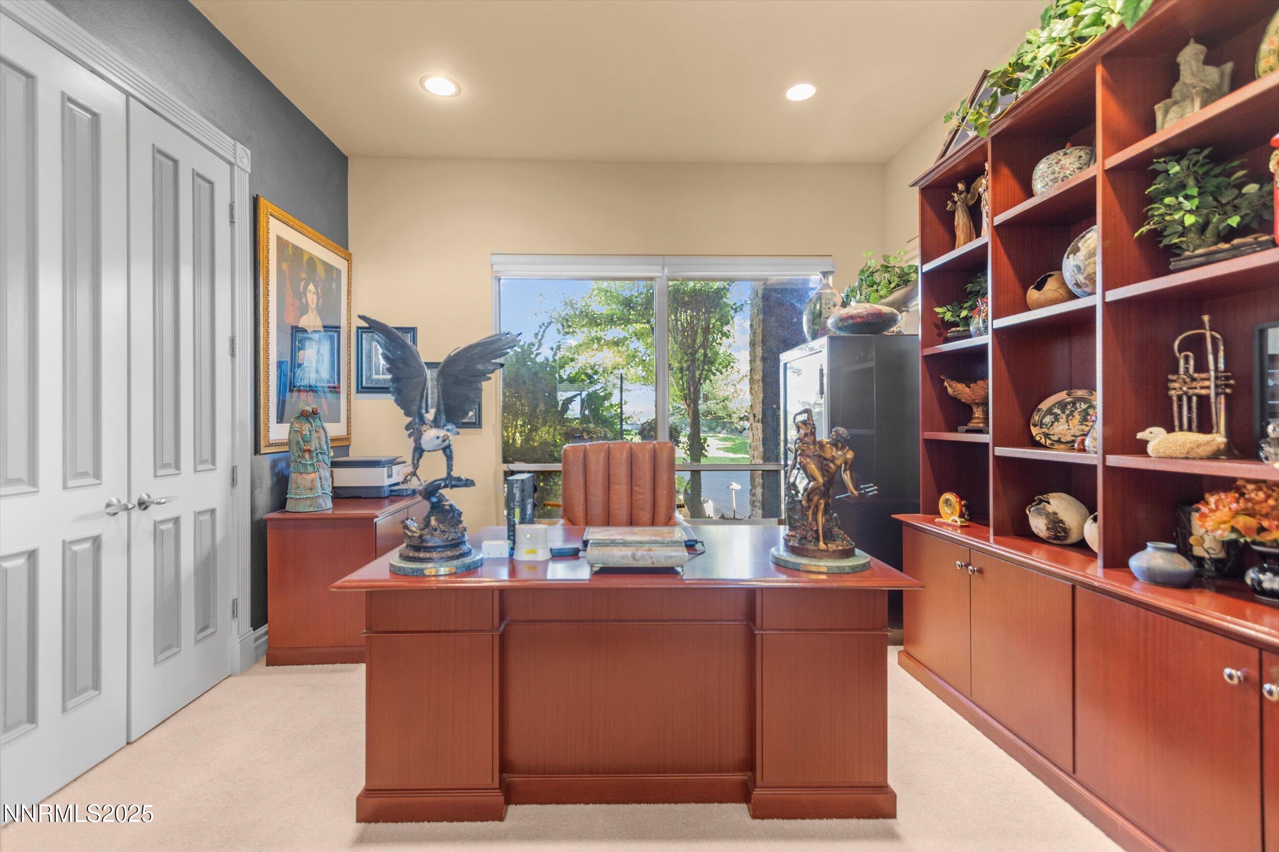10411 Copper Cloud Drive Reno, NV 89511 - Photo 24 of 54 a living room with furniture and a book shelf