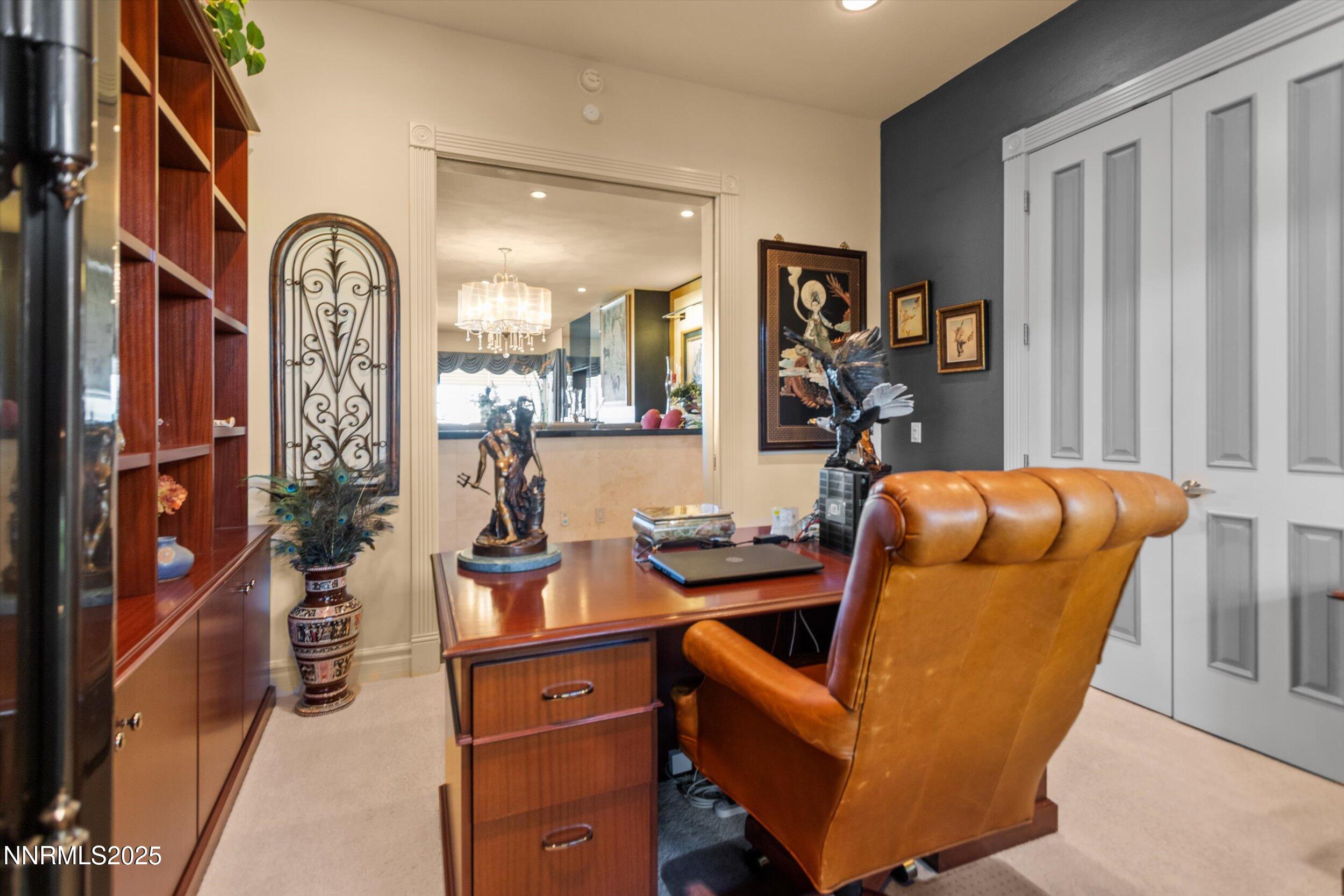 10411 Copper Cloud Drive Reno, NV 89511 - Photo 25 of 54 a living room with furniture a chandelier and a window