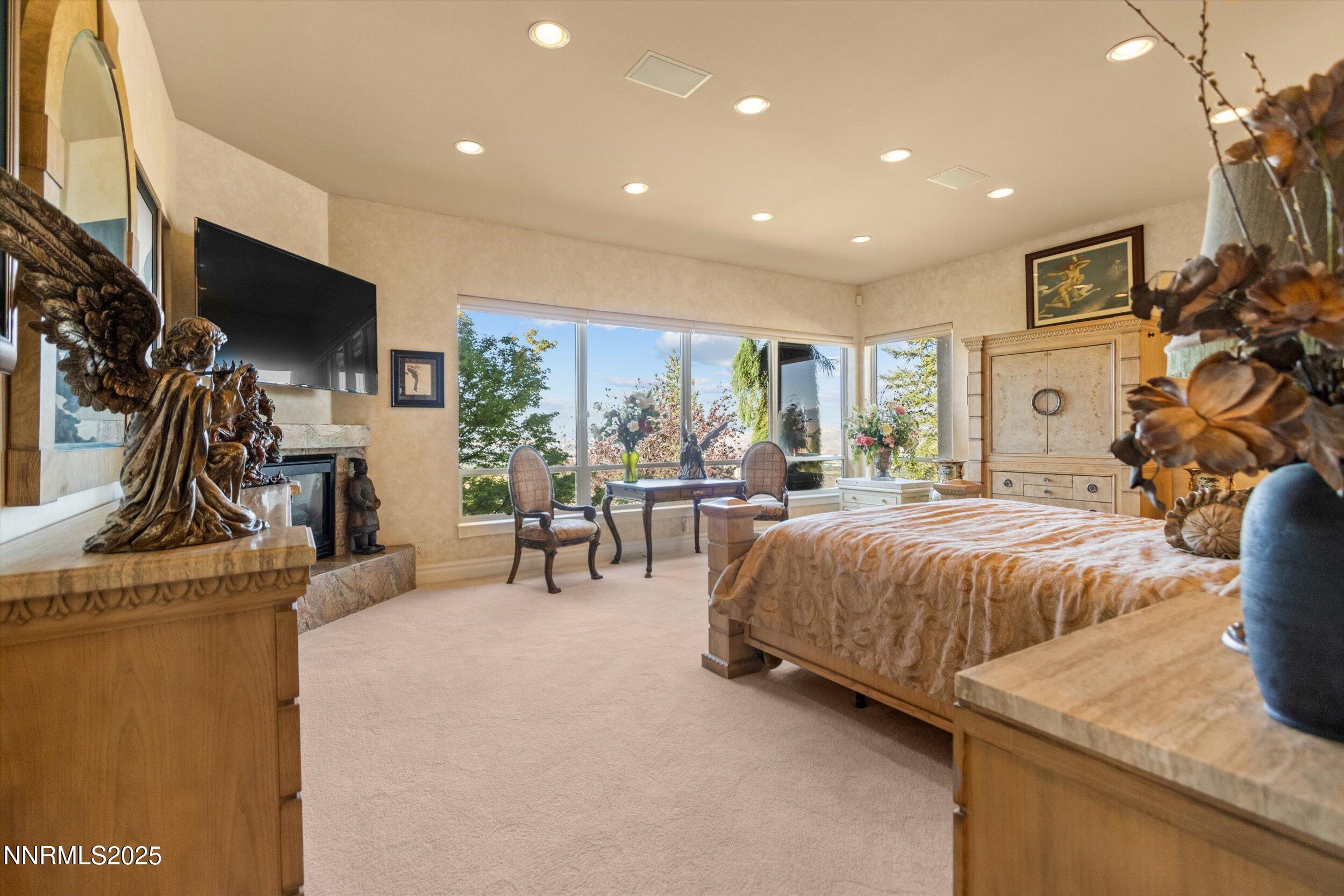 10411 Copper Cloud Drive Reno, NV 89511 - Photo 26 of 54 a spacious bedroom with a bed and a flat screen tv