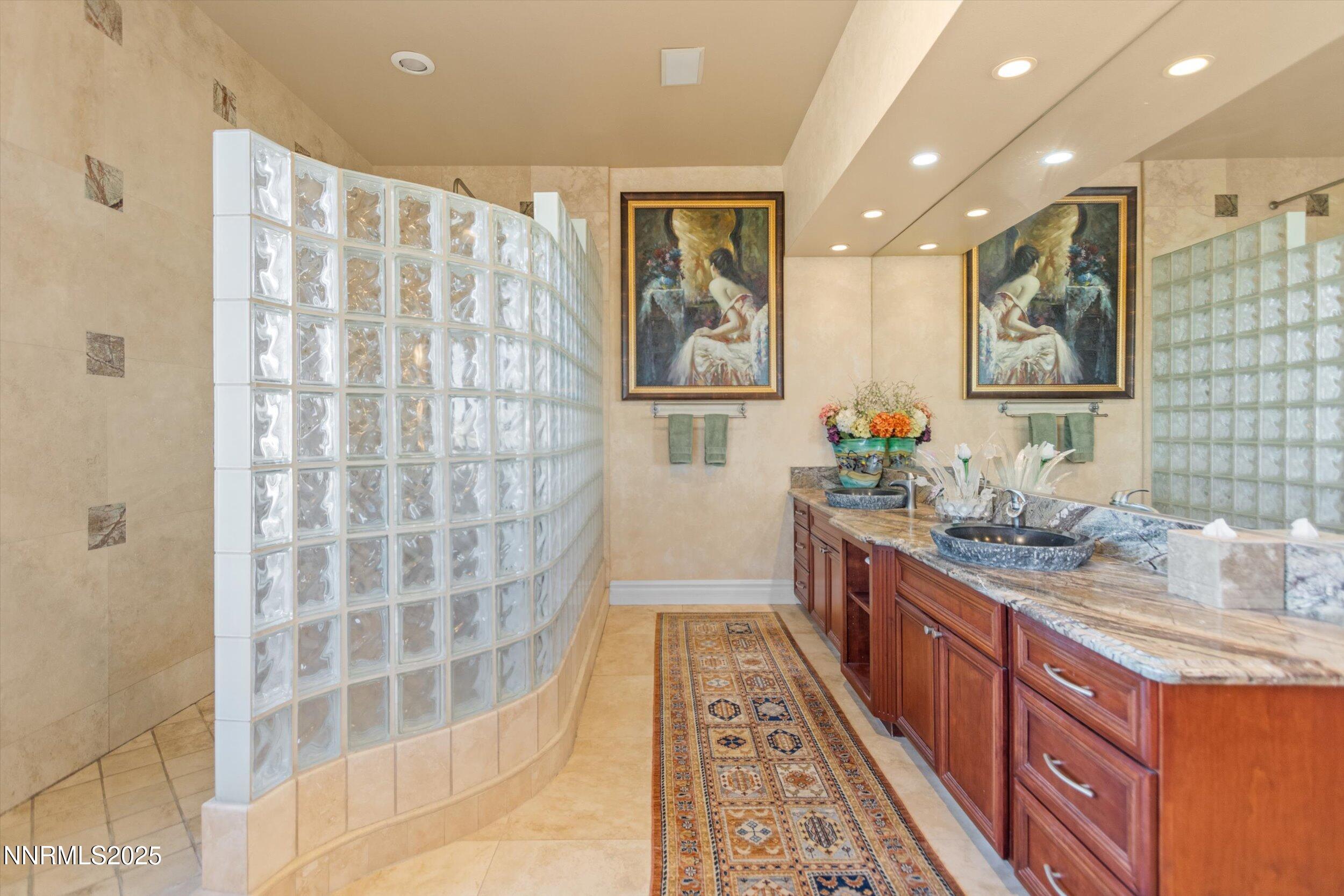10411 Copper Cloud Drive Reno, NV 89511 - Photo 28 of 54 a kitchen with stainless steel appliances granite countertop a sink and a granite counter tops