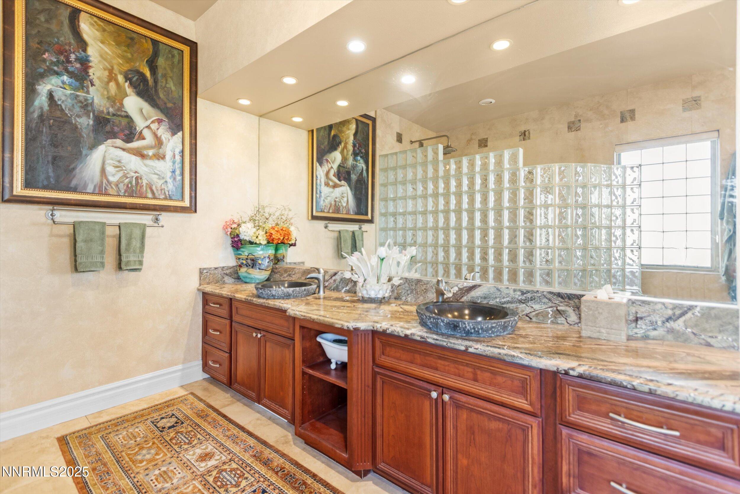 10411 Copper Cloud Drive Reno, NV 89511 - Photo 29 of 54 a kitchen with stainless steel appliances granite countertop a sink stove and cabinets