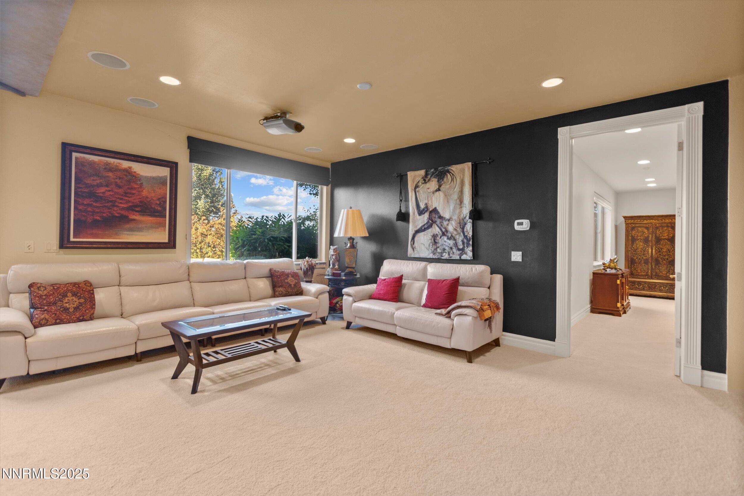 10411 Copper Cloud Drive Reno, NV 89511 - Photo 32 of 54 a living room with furniture and a couch