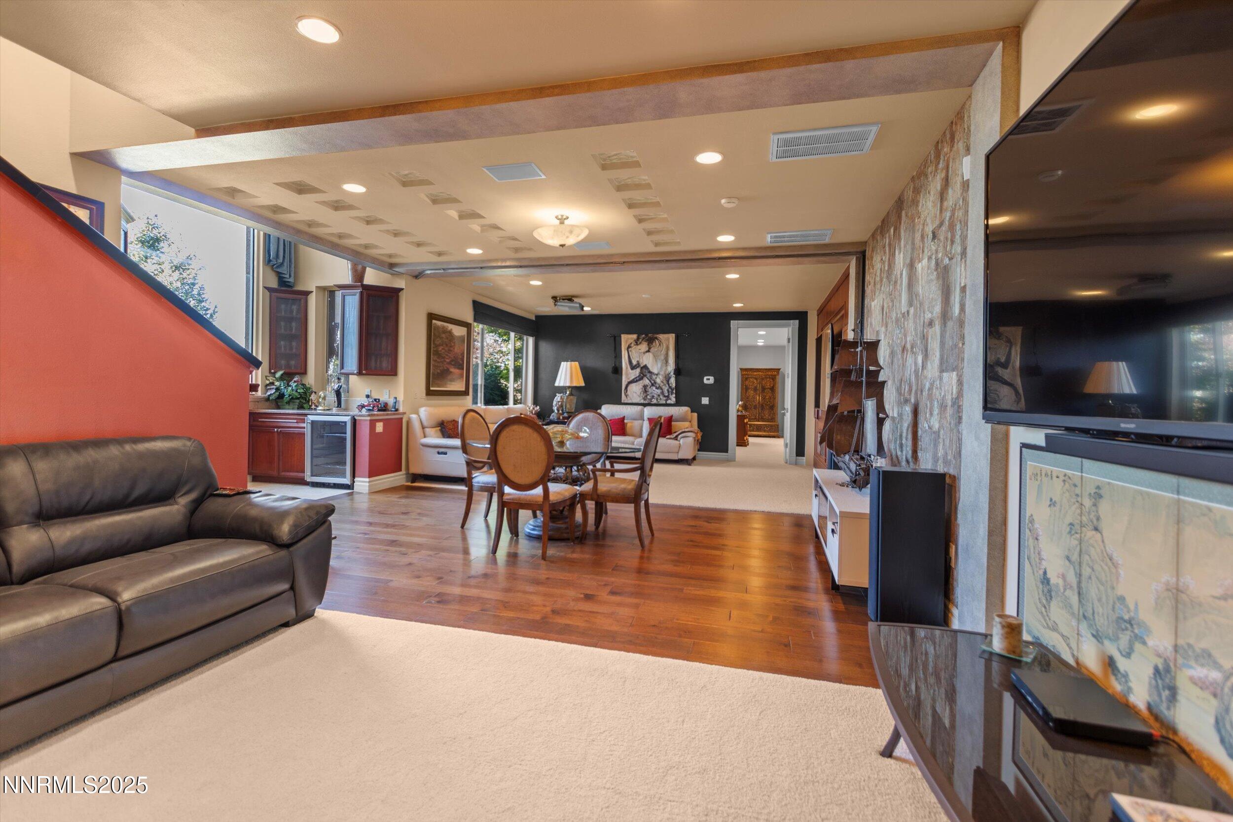 10411 Copper Cloud Drive Reno, NV 89511 - Photo 34 of 54 a living room with furniture and a wooden floor