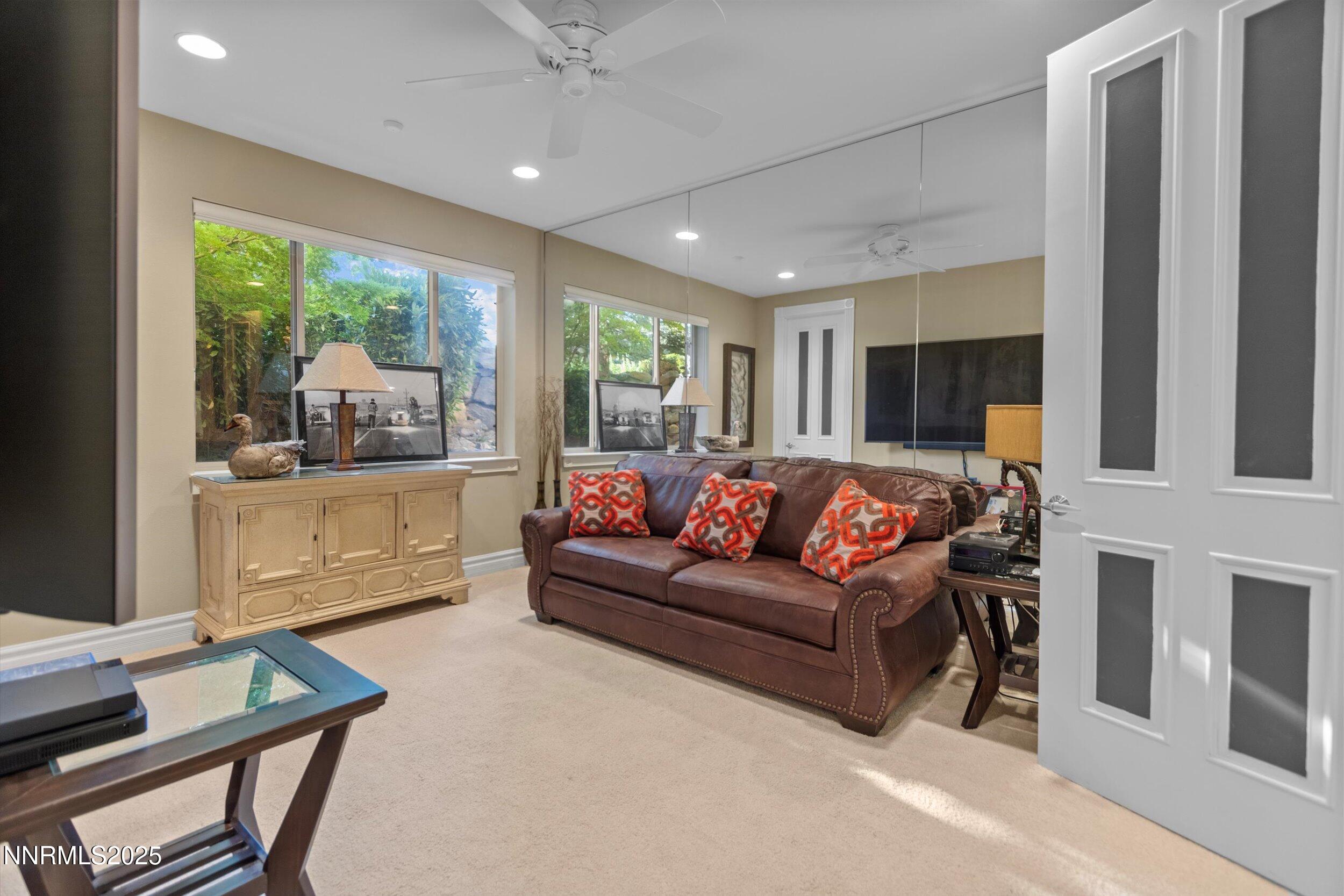 10411 Copper Cloud Drive Reno, NV 89511 - Photo 38 of 54 a living room with furniture and a large window