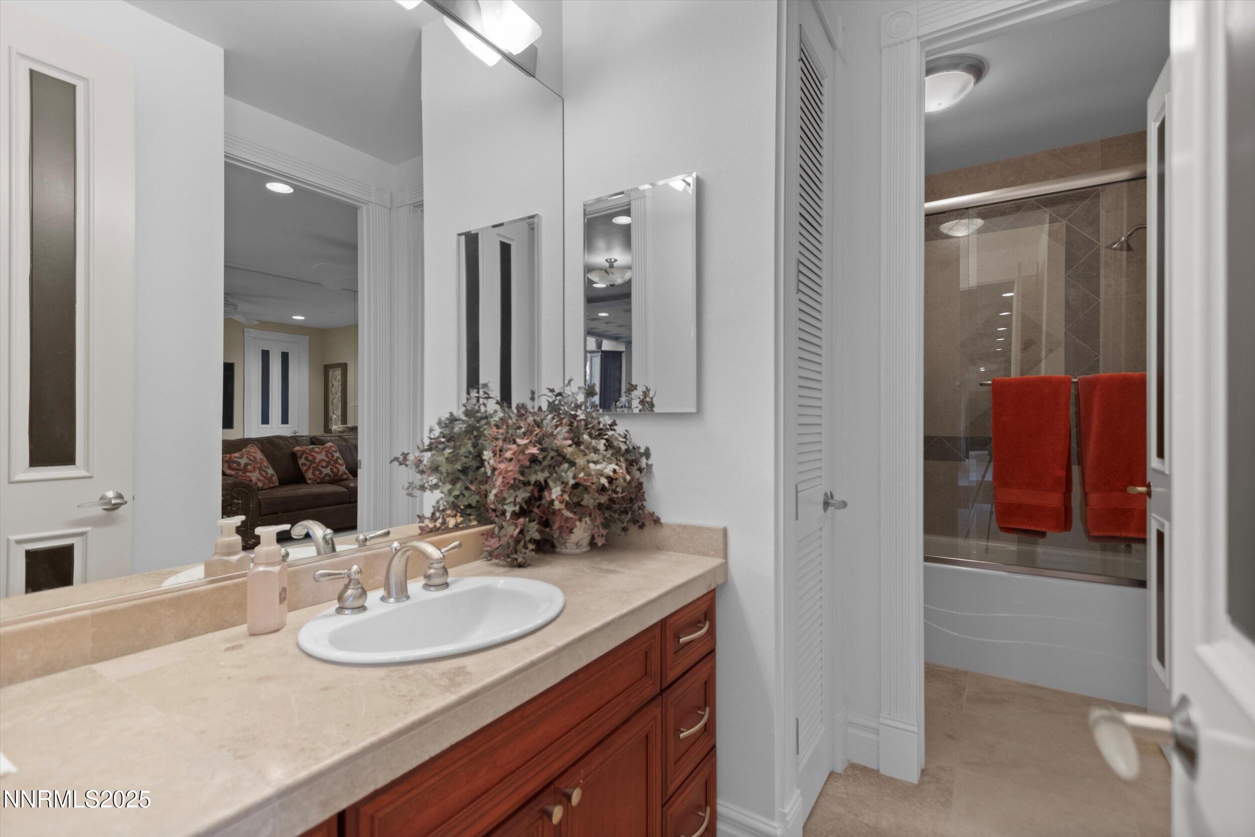 10411 Copper Cloud Drive Reno, NV 89511 - Photo 39 of 54 a bathroom with a sink and a mirror