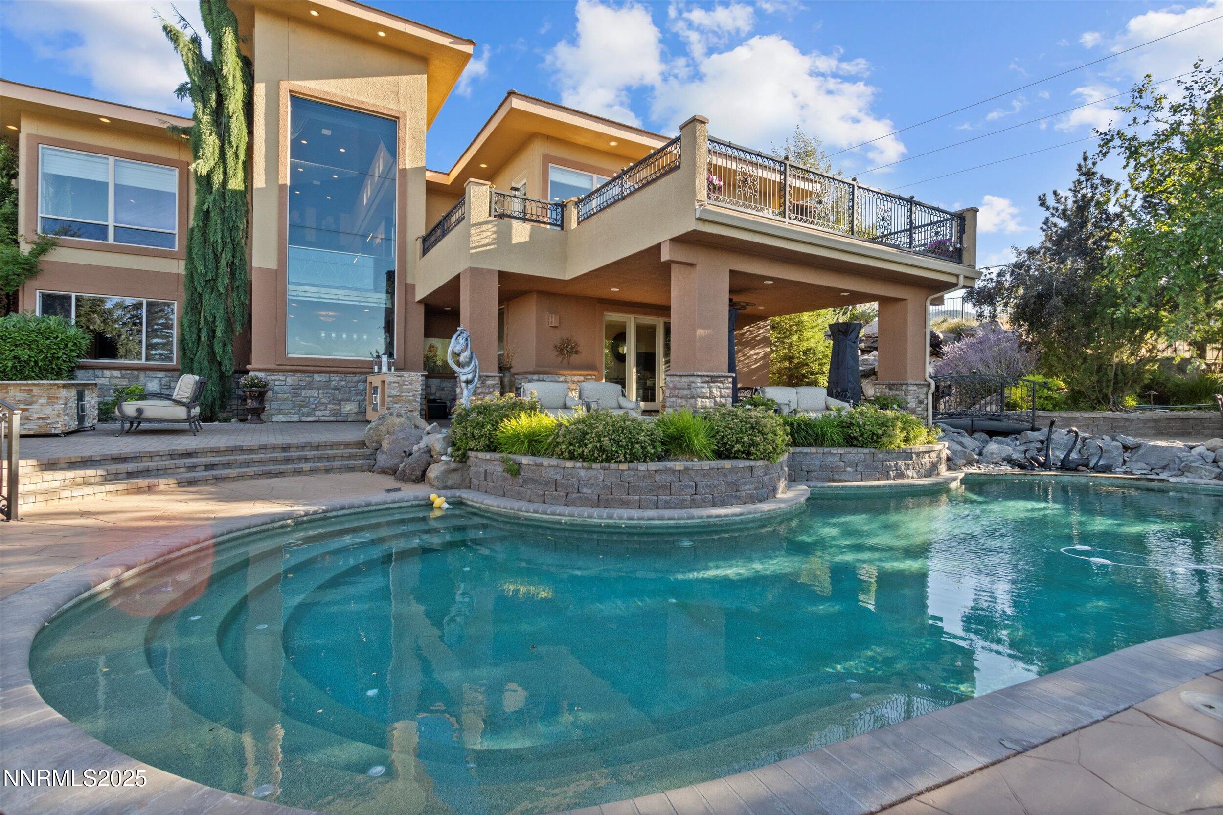 10411 Copper Cloud Drive Reno, NV 89511 - Photo 47 of 54 a view of a house with a swimming pool