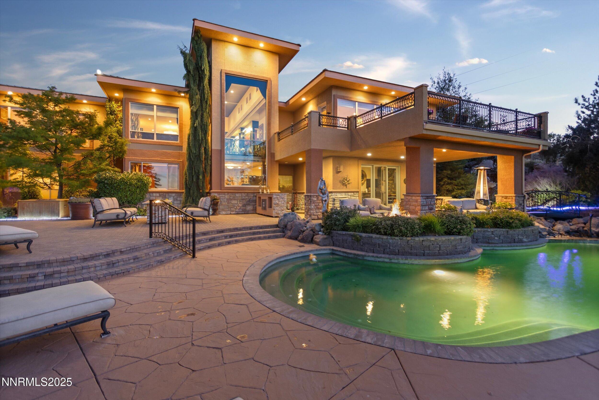 10411 Copper Cloud Drive Reno, NV 89511 - Photo 48 of 54 a view of a house with swimming pool and sitting area