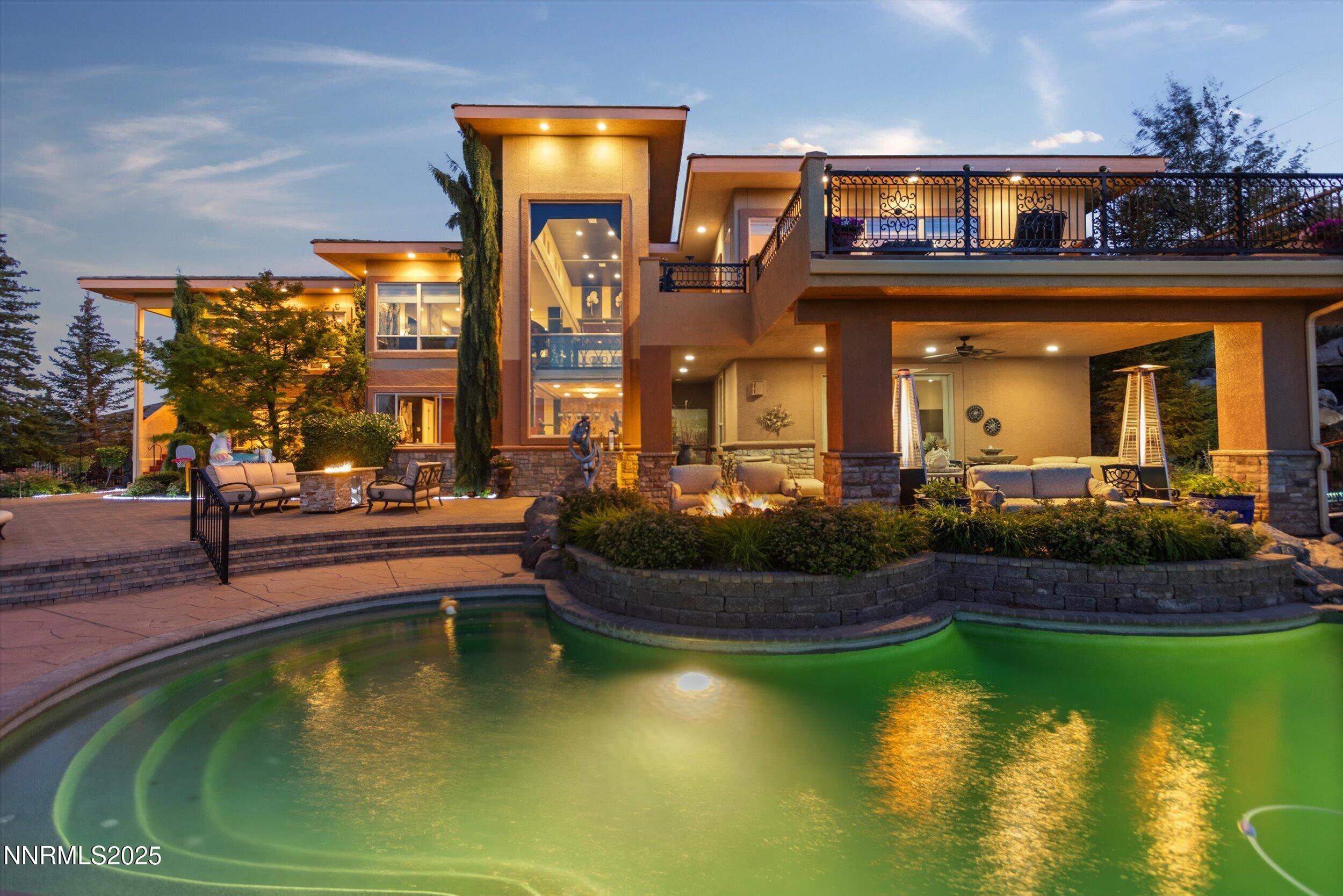 10411 Copper Cloud Drive Reno, NV 89511 - Photo 49 of 54 a view of a house with swimming pool and outdoor space