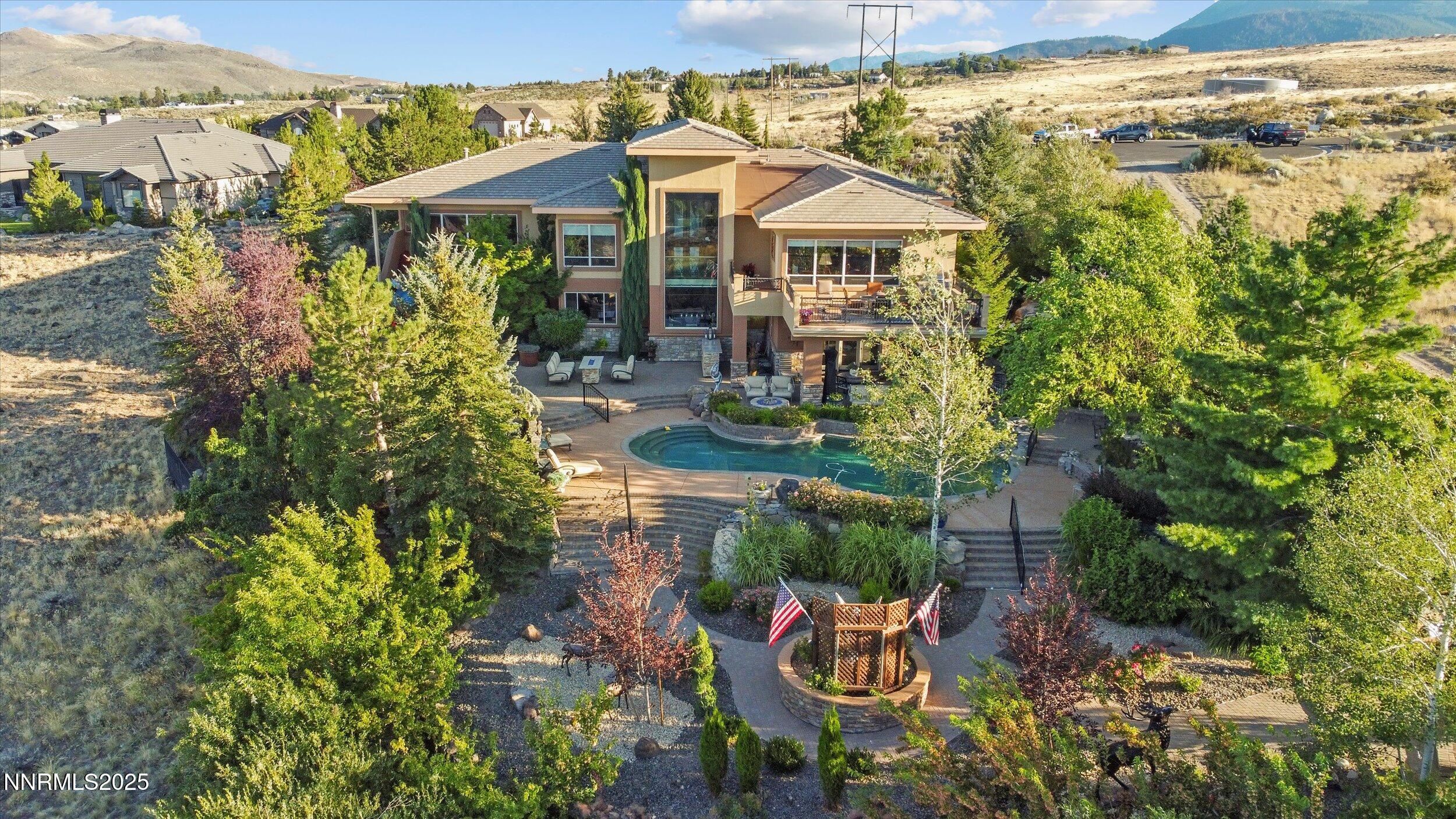 10411 Copper Cloud Drive Reno, NV 89511 - Photo 50 of 54 a view of a patio with table and chairs potted plants