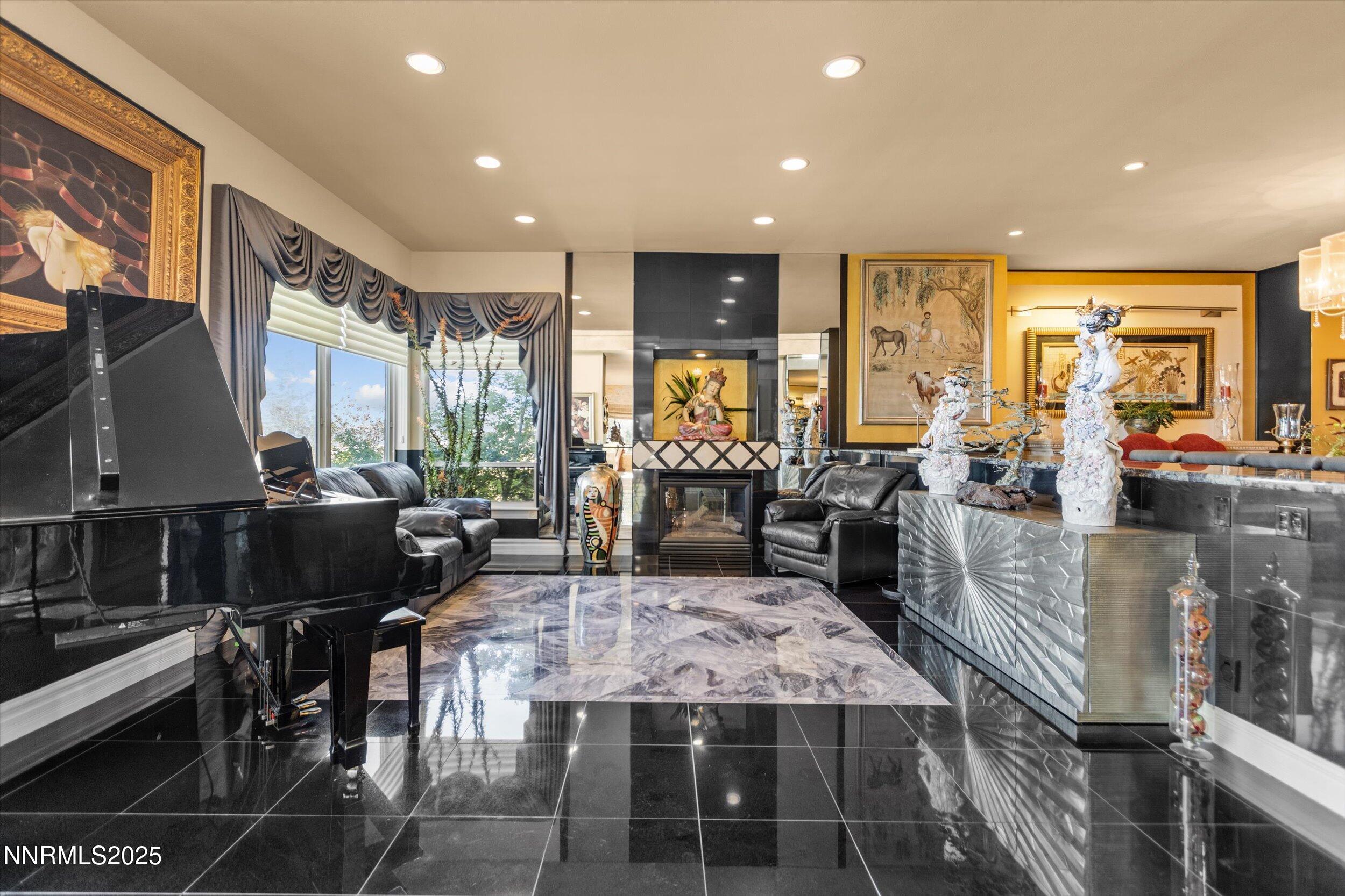 10411 Copper Cloud Drive Reno, NV 89511 - Photo 7 of 54 a kitchen with stainless steel appliances granite countertop a stove and a view of dining room