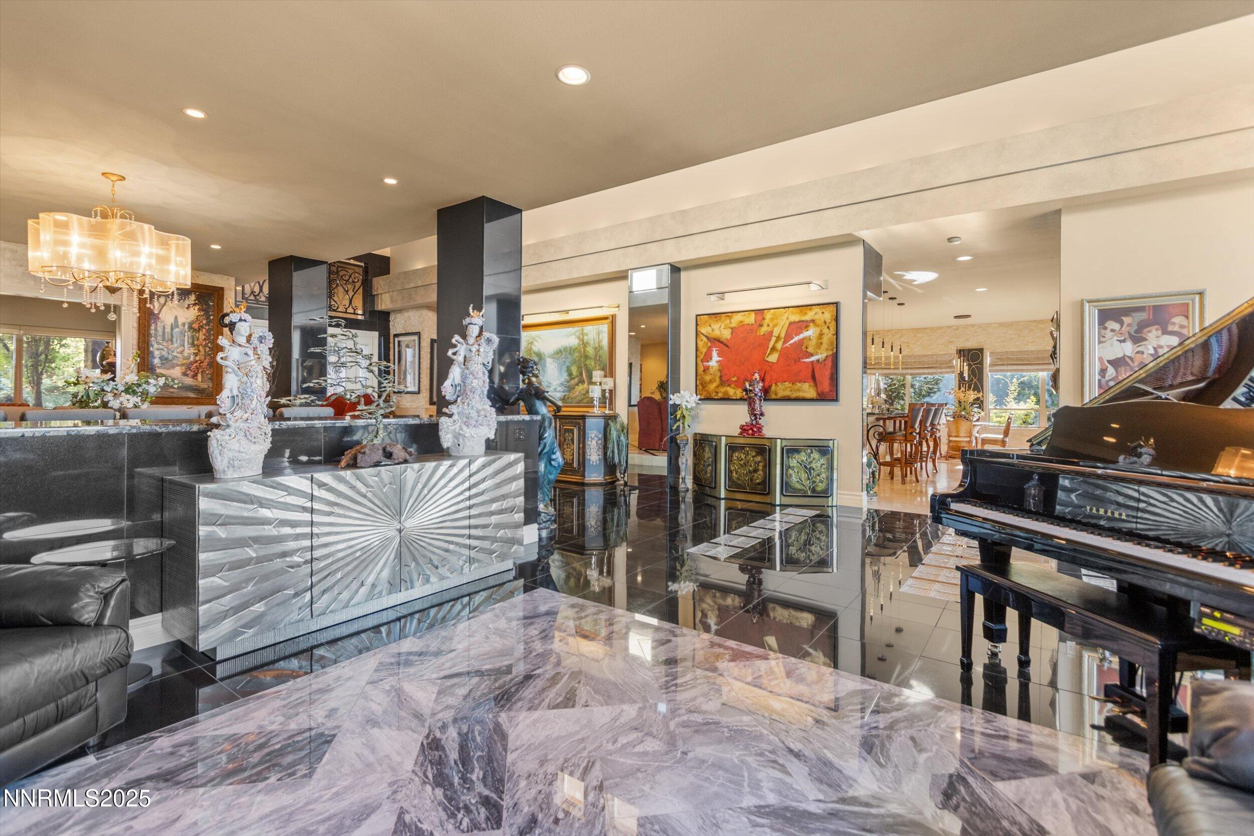 10411 Copper Cloud Drive Reno, NV 89511 - Photo 8 of 54 a living room with furniture and a flat screen tv
