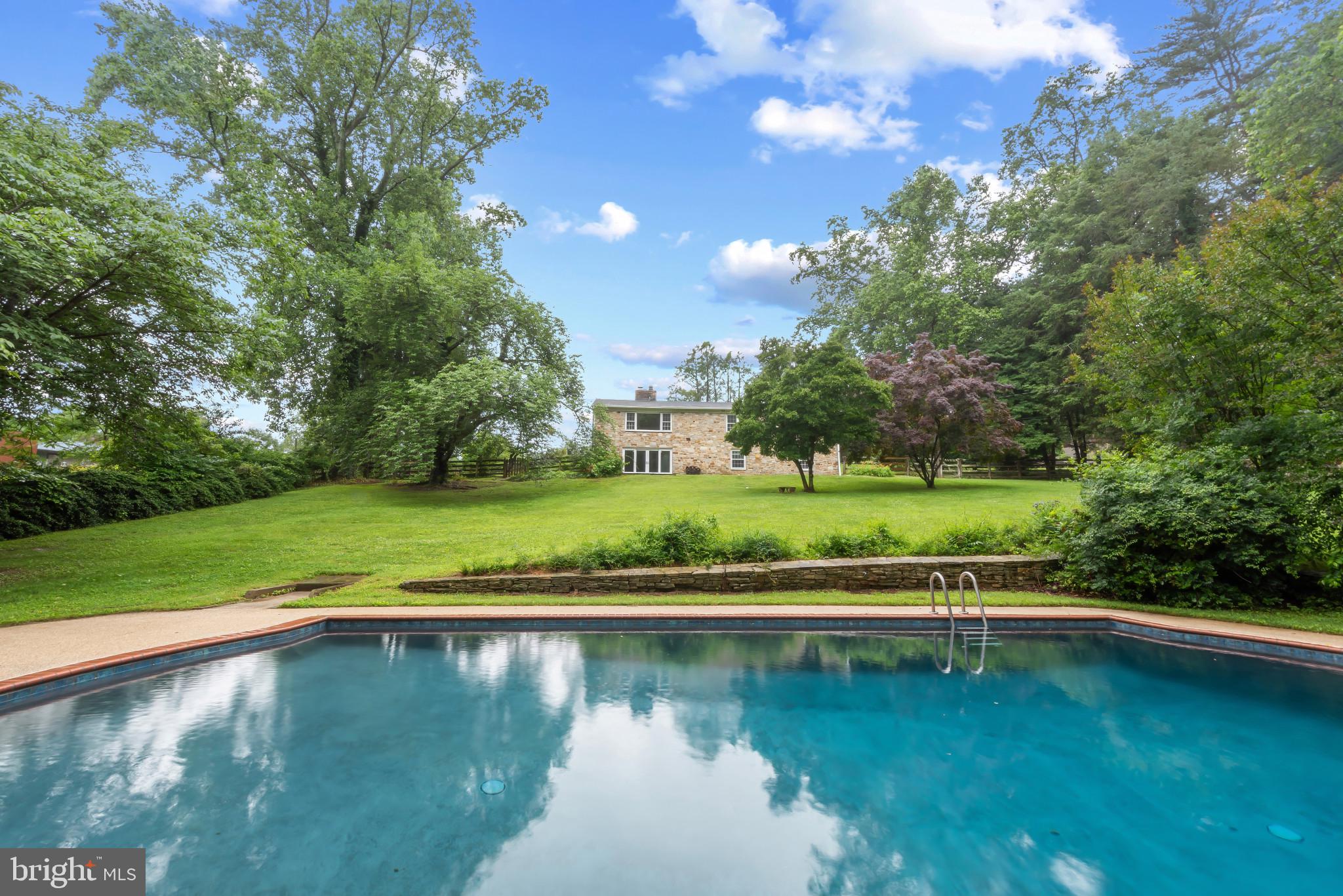 13409 Cambria Farms Road Phoenix, MD 21131 - Photo 2 of 54 a view of a lake with a yard