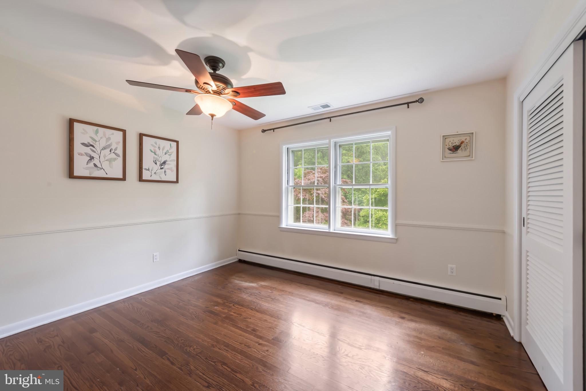 13409 Cambria Farms Road Phoenix, MD 21131 - Photo 21 of 54 wooden floor in an empty room with a window