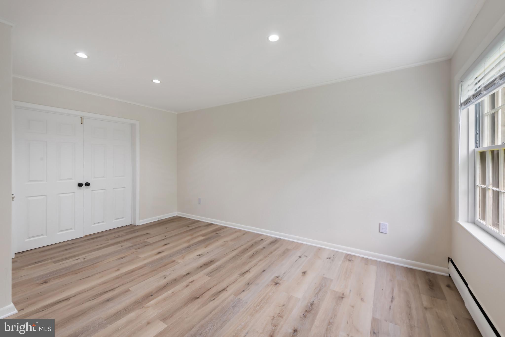 13409 Cambria Farms Road Phoenix, MD 21131 - Photo 42 of 54 wooden floor in an empty room with a window