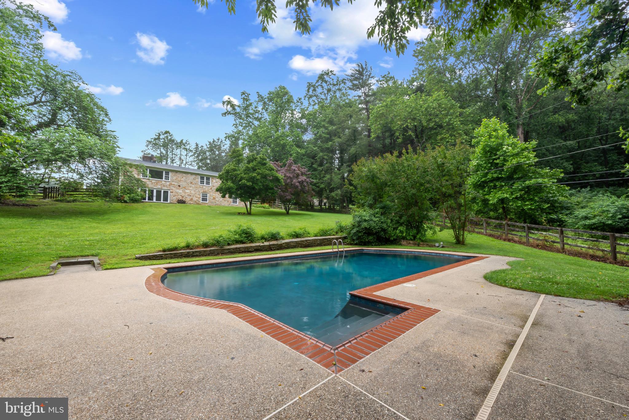 13409 Cambria Farms Road Phoenix, MD 21131 - Photo 48 of 54 a view of a swimming pool with a yard