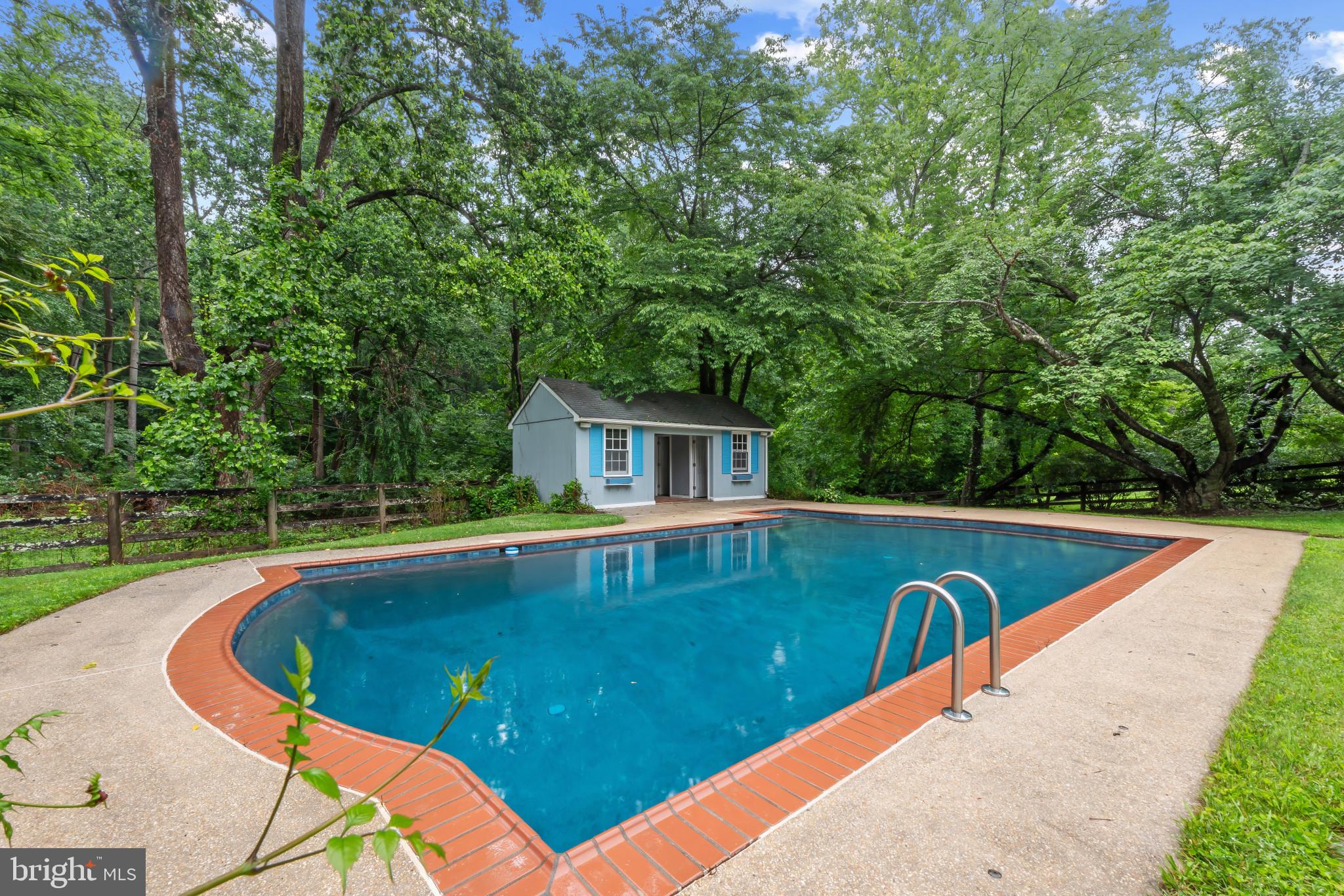 13409 Cambria Farms Road Phoenix, MD 21131 - Photo 49 of 54 a view of a swimming pool with a patio