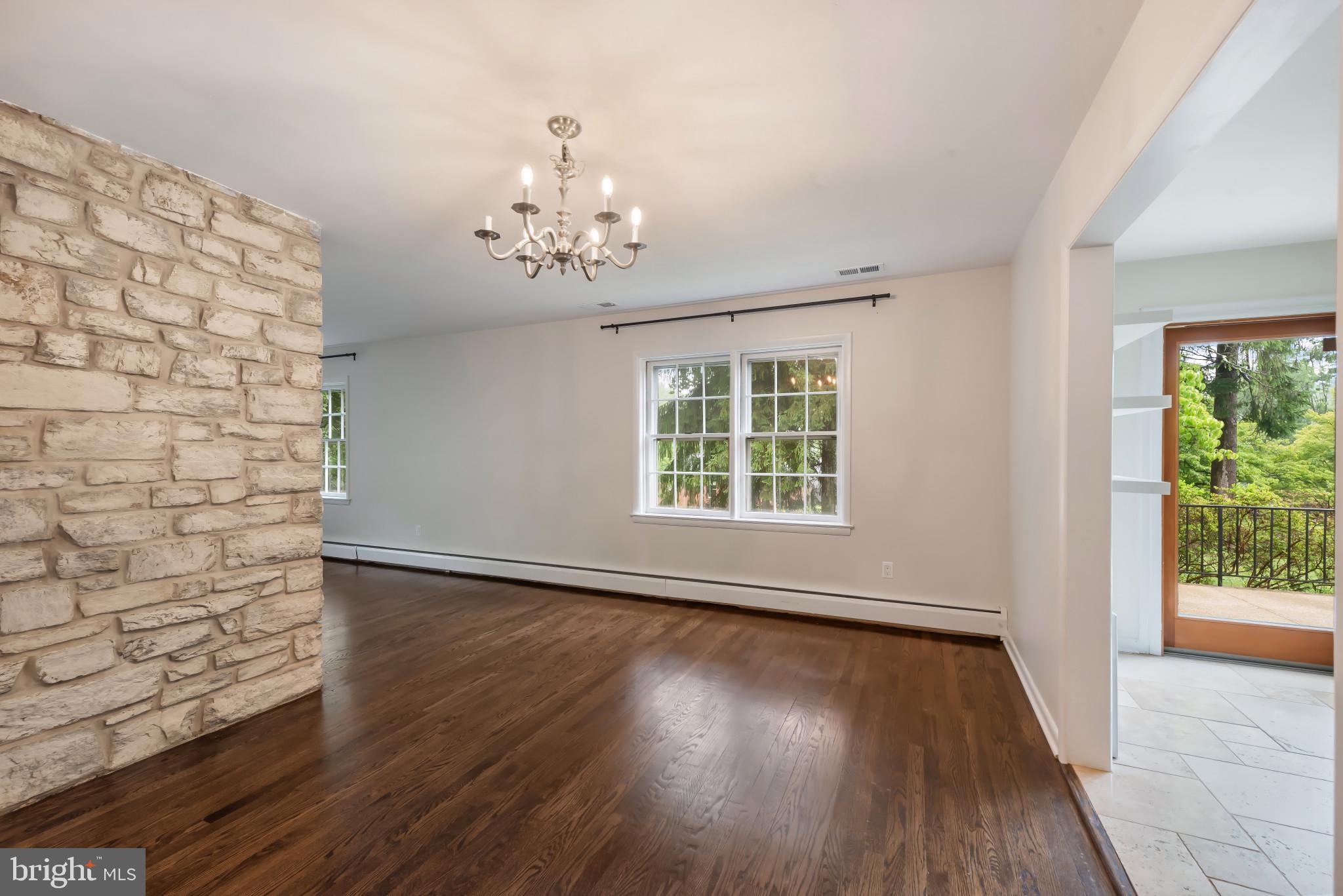 13409 Cambria Farms Road Phoenix, MD 21131 - Photo 7 of 54 a view of a livingroom with wooden floor and a large window