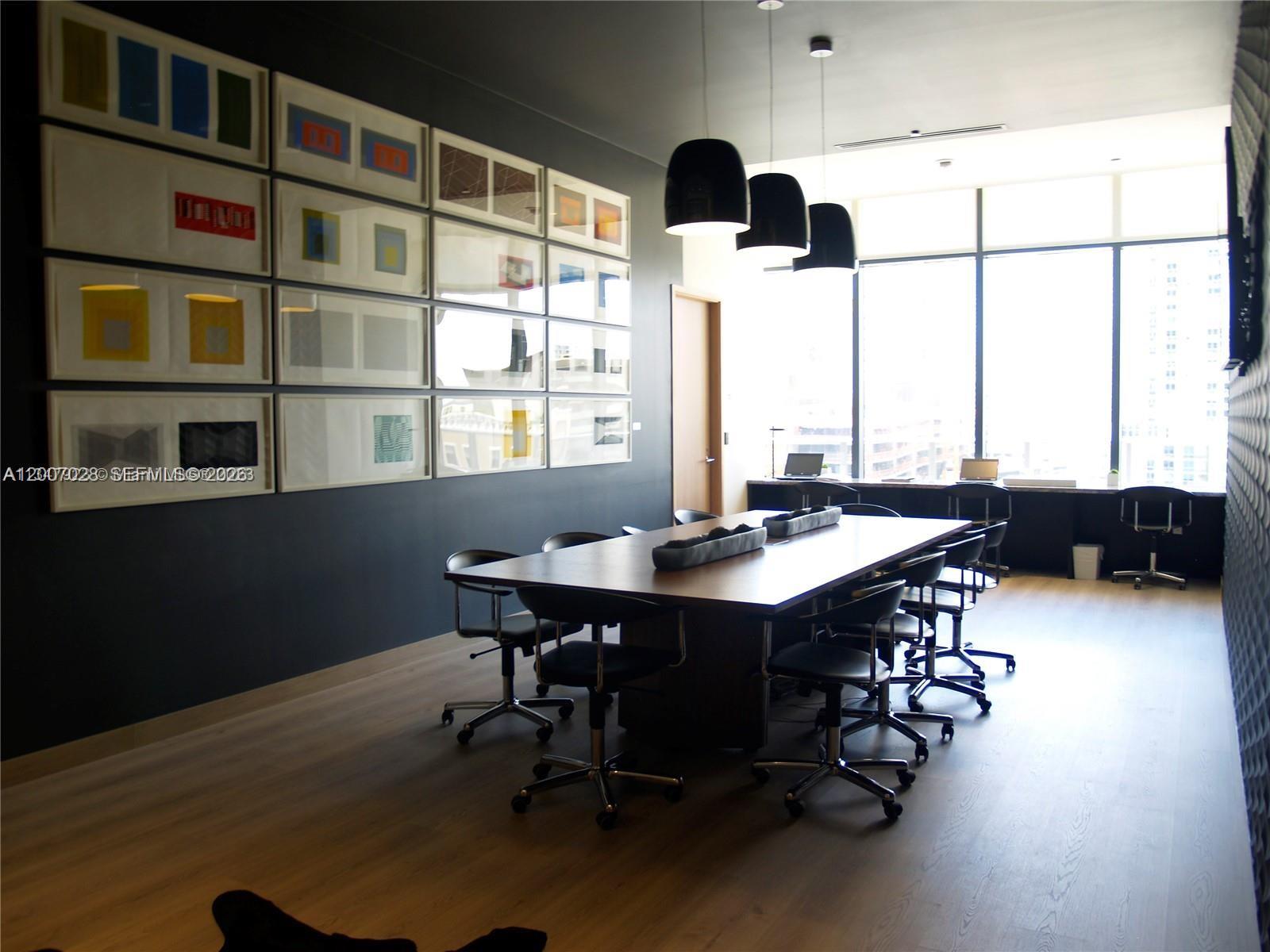 55 Southwest 9th Street, Unit 2502 Miami, FL 33130 - Photo 18 of 27 a view of a workspace with furniture and window