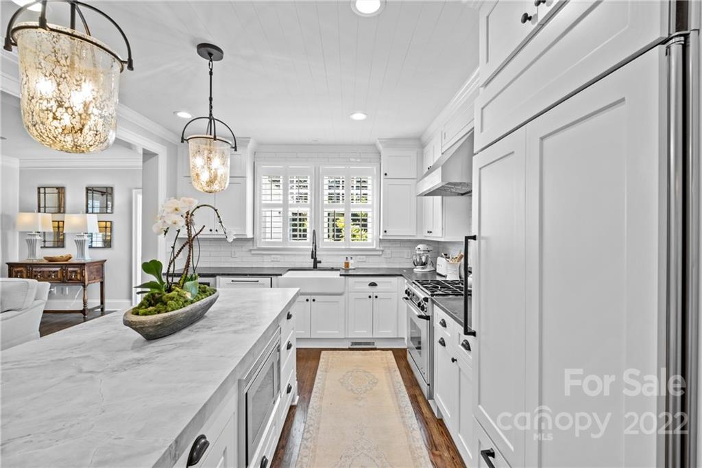 2156 Colony Road Charlotte, NC 28209 - Photo 15 of 46 a kitchen with stainless steel appliances granite countertop a lot of counter space