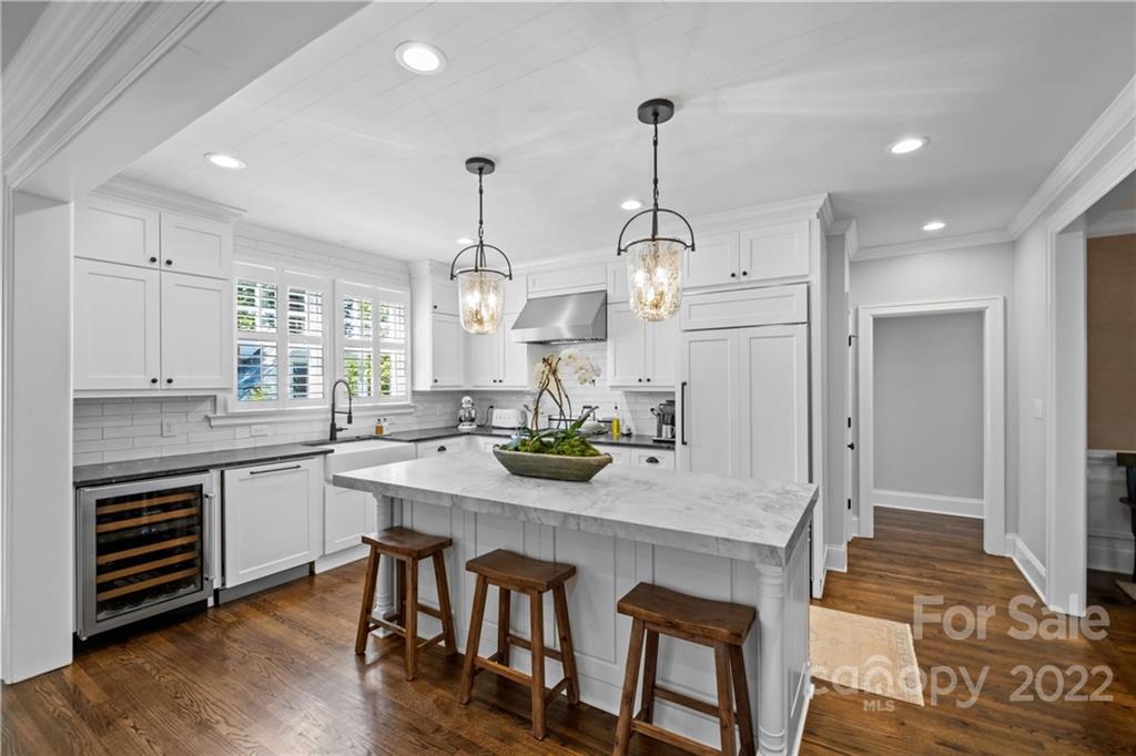 2156 Colony Road Charlotte, NC 28209 - Photo 17 of 46 a kitchen with granite countertop white cabinets and stainless steel appliances