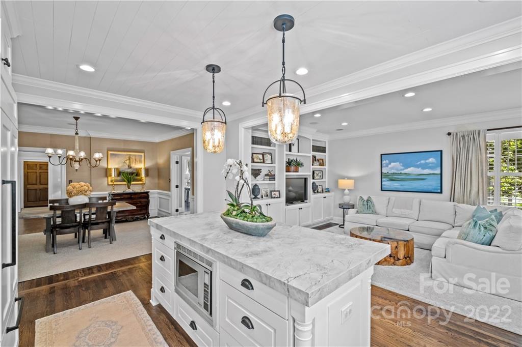 2156 Colony Road Charlotte, NC 28209 - Photo 22 of 46 a kitchen with stainless steel appliances granite countertop a stove and a wooden floor