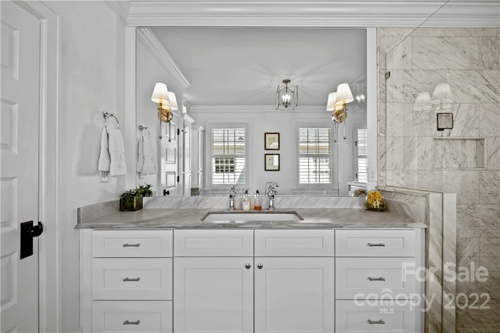2156 Colony Road Charlotte, NC 28209 - Photo 31 of 46 a bathroom with a sink and a mirror