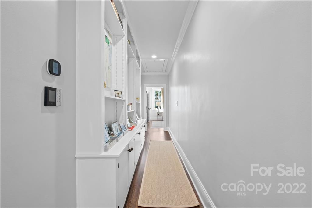 2156 Colony Road Charlotte, NC 28209 - Photo 32 of 46 a view of a hallway with wooden floor and staircase